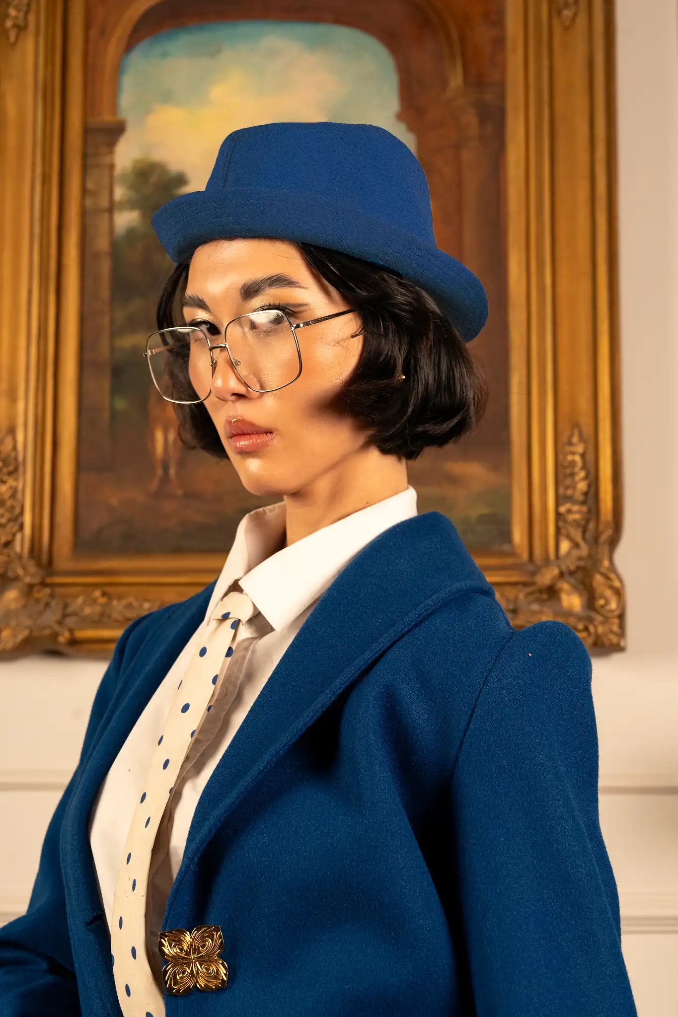 Bleu royal coat with a rich blue tone and commanding elegant silhouette, conveying prestige, confidence, and refined style