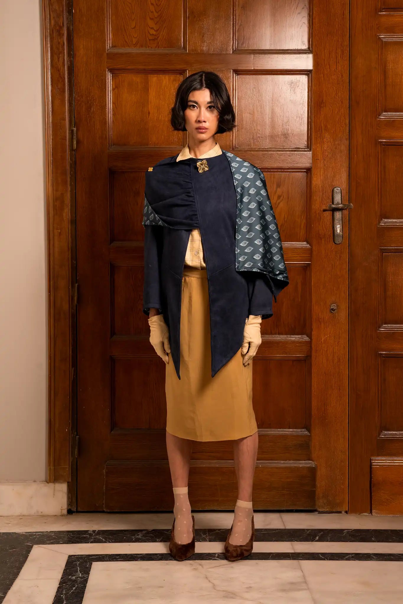 Dark blue empress cape with a rich deep tone and fluid elegant design, conveying regal sophistication and authority