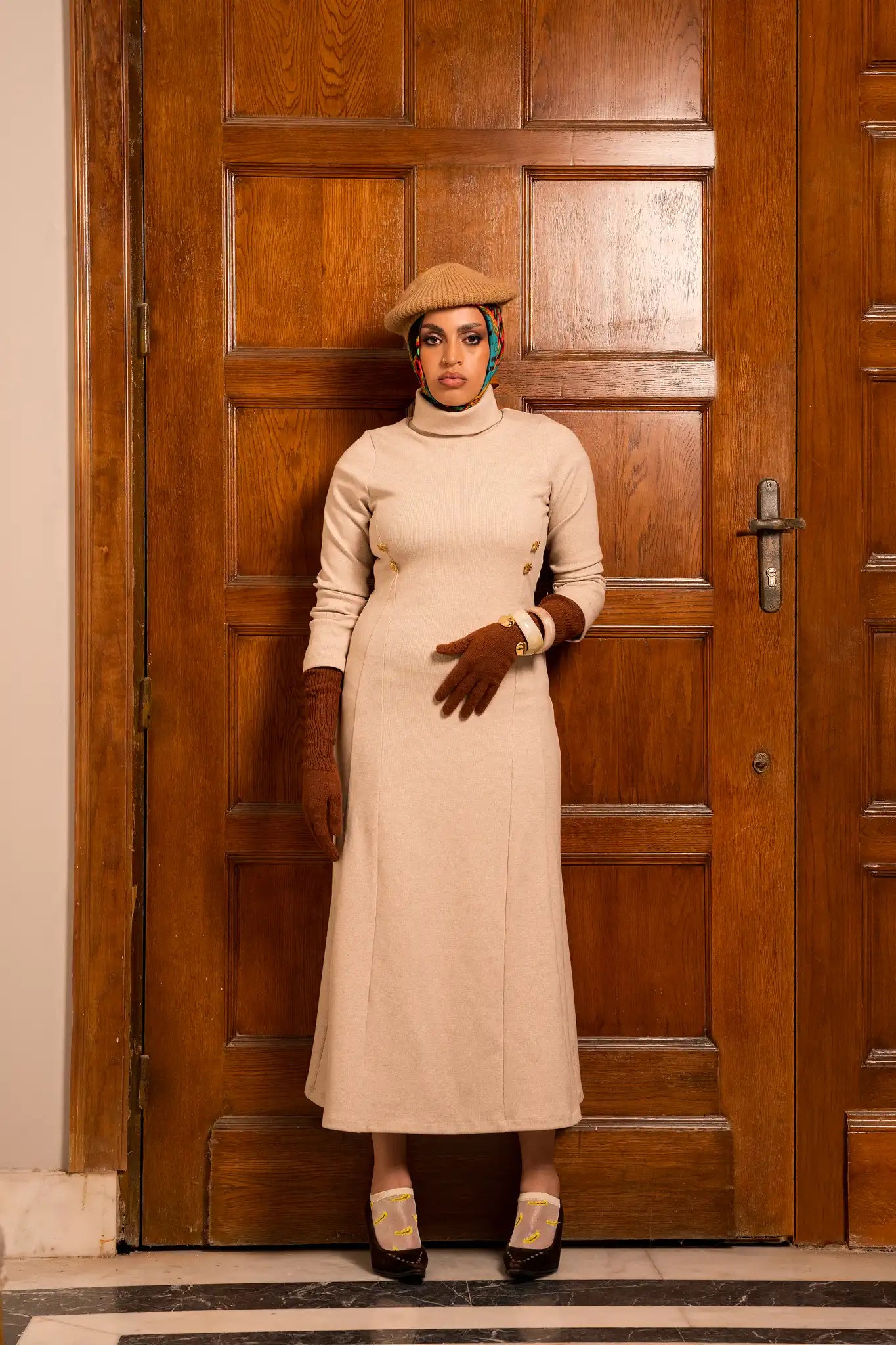 Iconic ivory dress with a refined modern design, featuring a soft ivory tone that conveys elegance and confidence