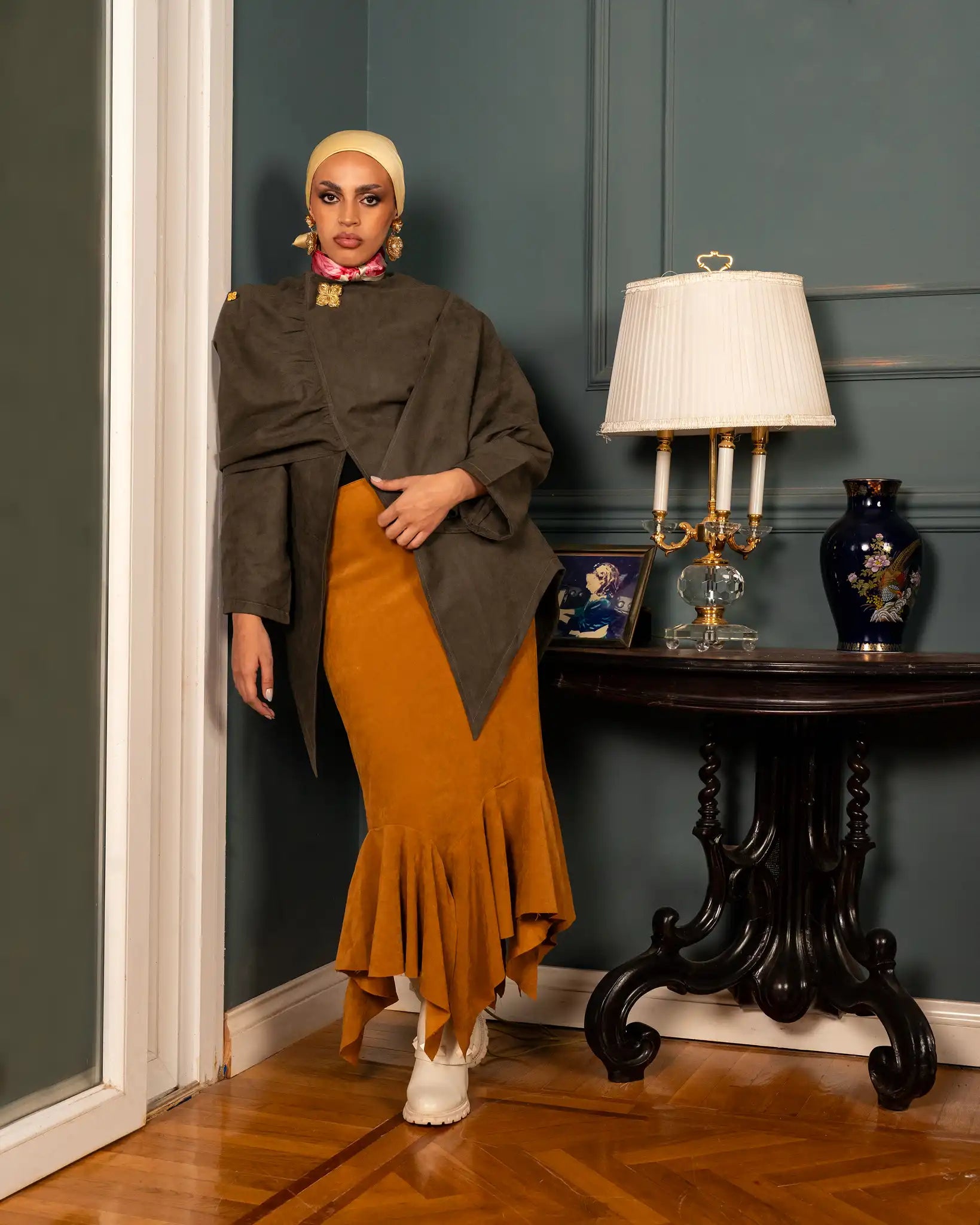 Elegant olive cape with a flowing and refined design