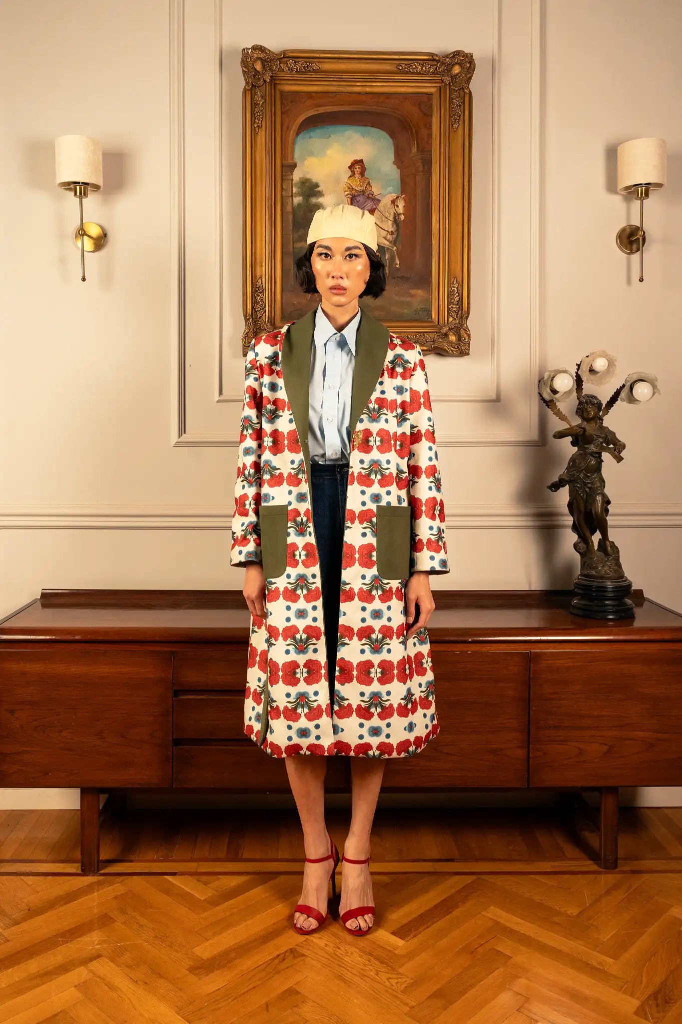Model wearing a rosette coat with delicate floral details and a refined vintage-inspired silhouette